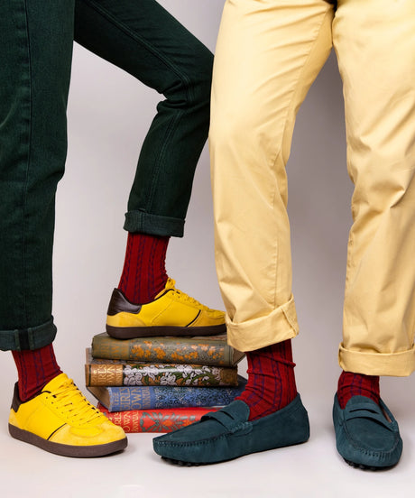 Two models lower legs wearing unisex, lightweight cable dressy cotton socks in red made in Canada by Toronto brand OkayOk