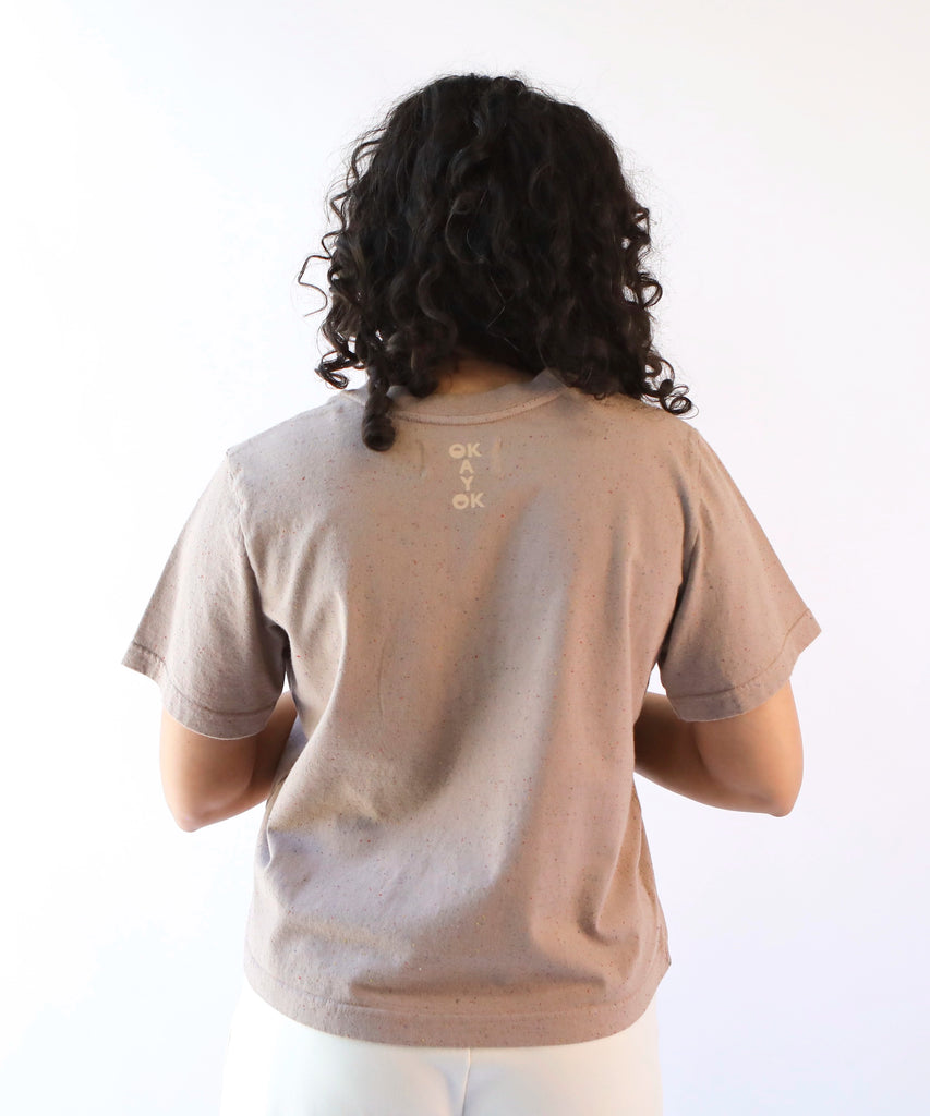 woman wearing a taupe cotton tshirt in boxy cropped cut