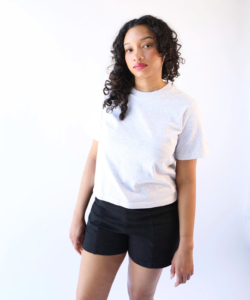 woman wearing a white cotton tshirt in boxy cropped cut