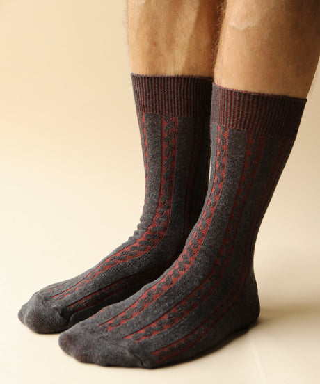 A pair of unisex, lightweight cable dressy cotton socks in dark grey with burnt orange made in Canada by Toronto brand OkayOk 