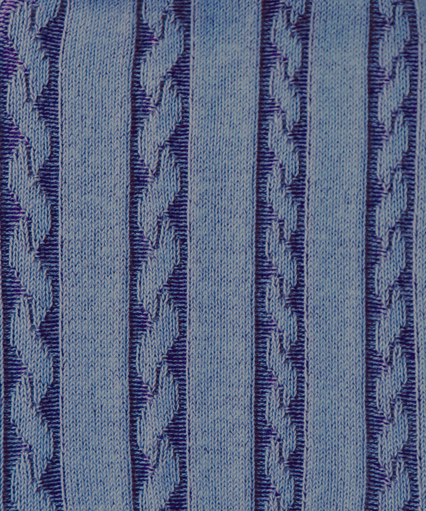Close-up of textured blue fabric with a subtle pattern