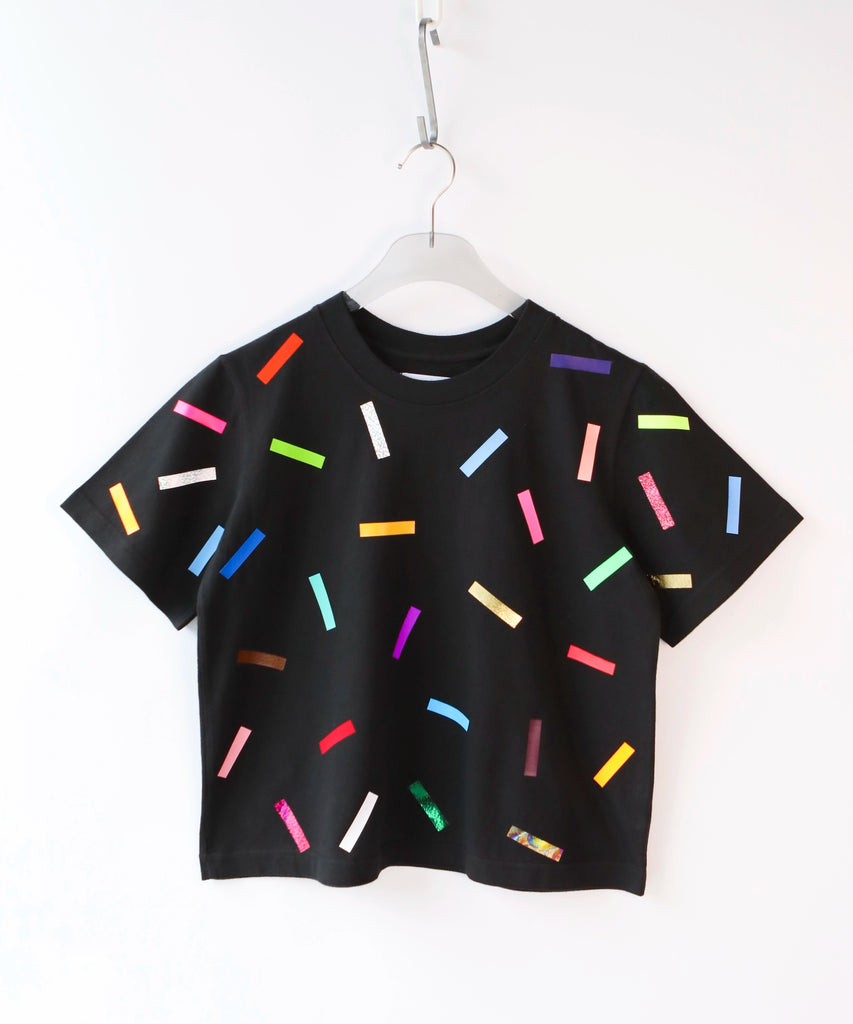 A cotton t-shirt with colorful confetti sprinkles pattern in black