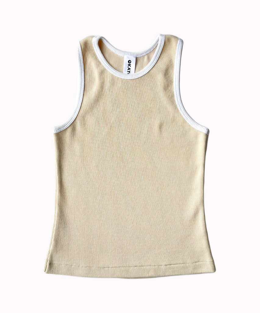 a beige cotton ribbed tank top with white trim 