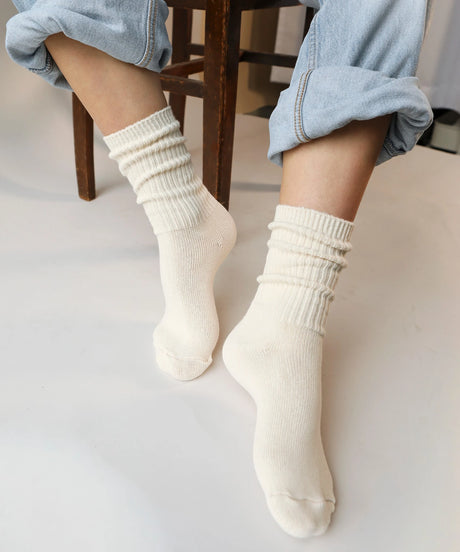 A pair of unisex ribbed crew cotton socks in natural made in Canada by Toronto brand OkayOk