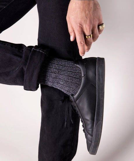 A pair of 100% cotton socks in a thick, heavy weight made in Canada by Toronto brand OkayOk styled with black shoes