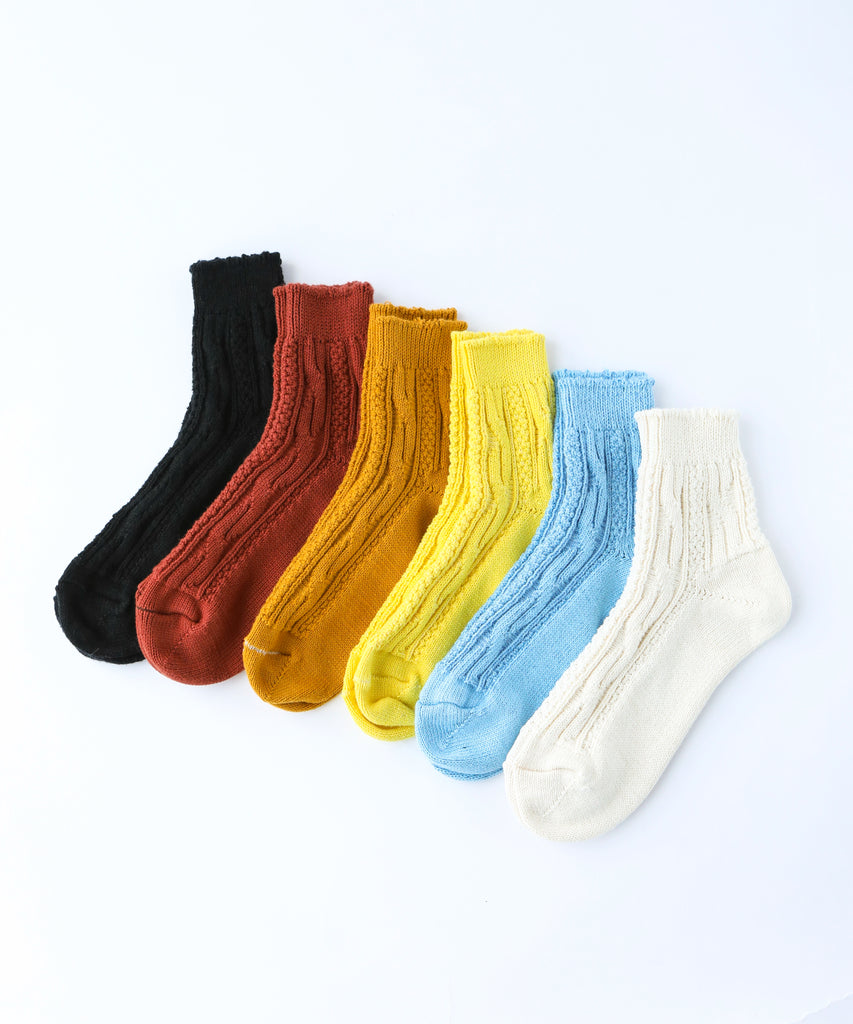 Set of six colorful cotton socks arranged in a row