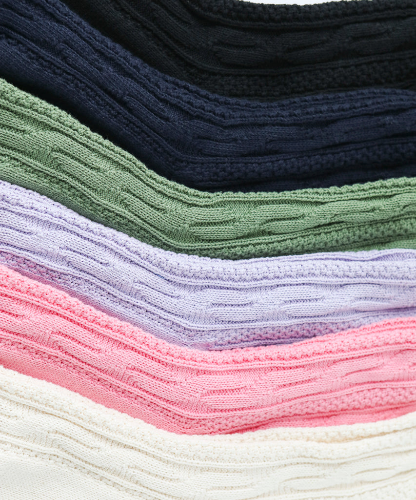 a pile of textured cotton knit socks