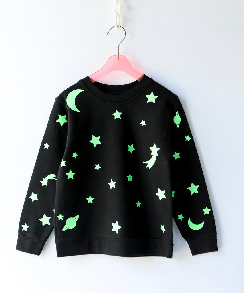 a glow in the dark star and moon printed cotton sweatshirt in black