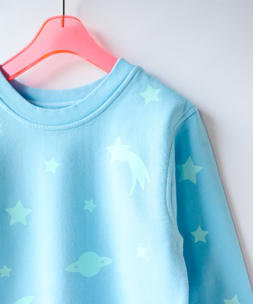 a glow in the dark star printed cotton sweatshirt in light blue