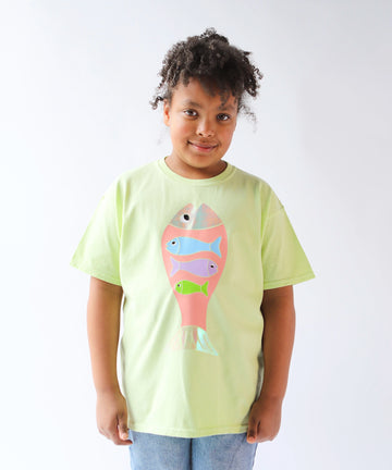 Child wearing a light green cotton t-shirt with a colorful fish design in pastel colours
