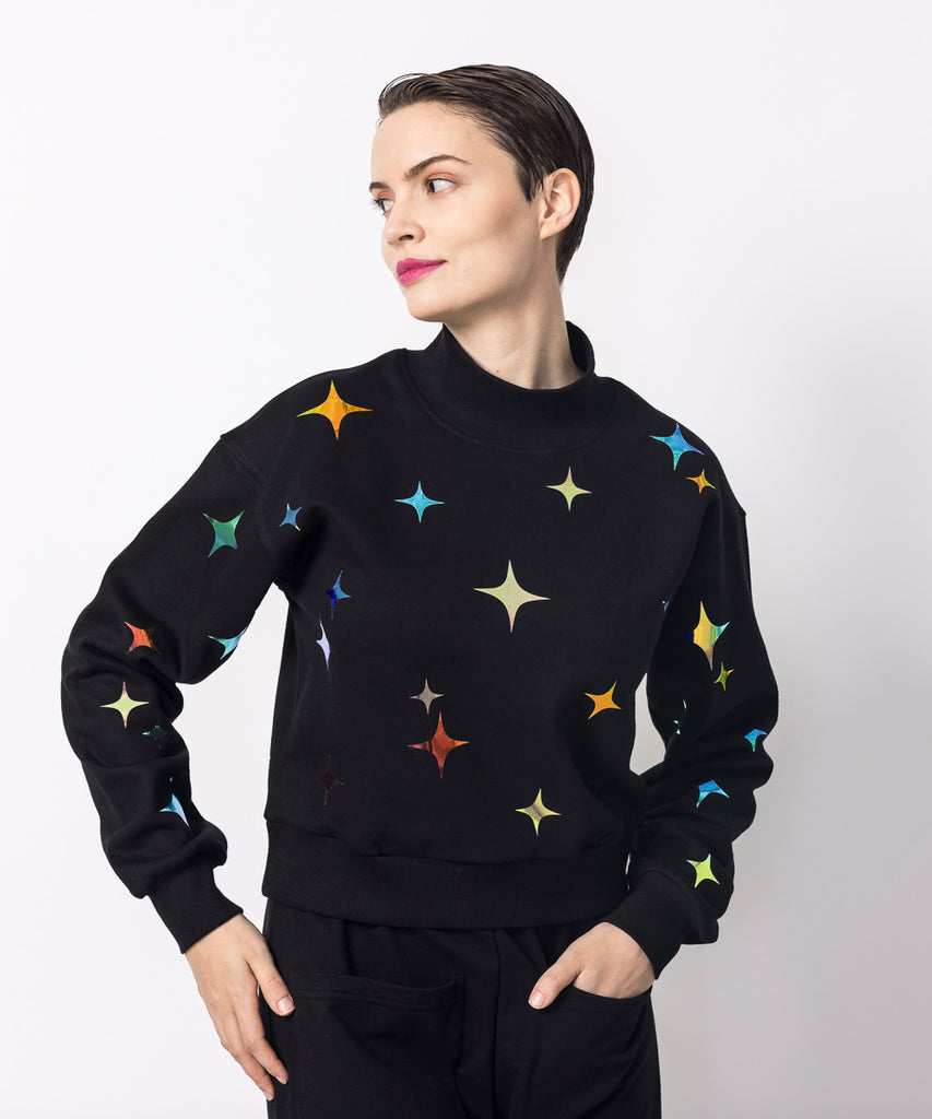 cropped black mockneck sweatshirt twinkle iridescent graphic