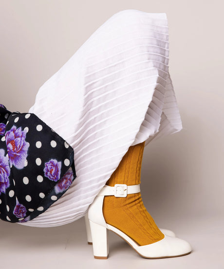 A pair of unisex, lightweight cable dressy cotton socks in mustard colour made in Canada by Toronto brand OkayOk