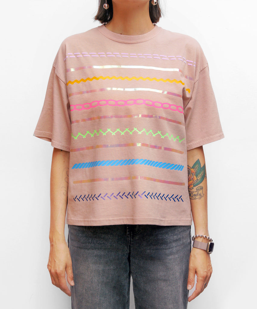 Pastel cotton oversized tee with textured pattern graphic
