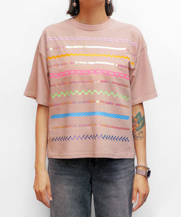 Pastel cotton oversized tee with textured pattern graphic