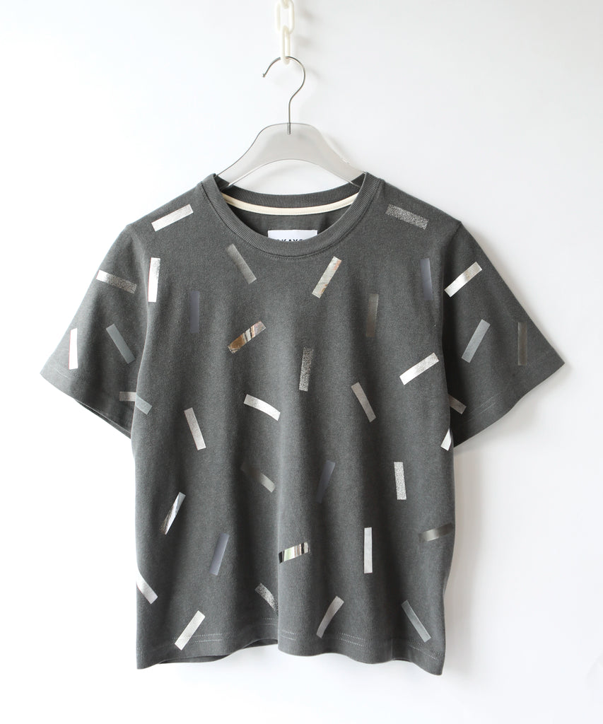 a boxy cotton tshirt in dark grey with silver confetti sprinkle graphic print