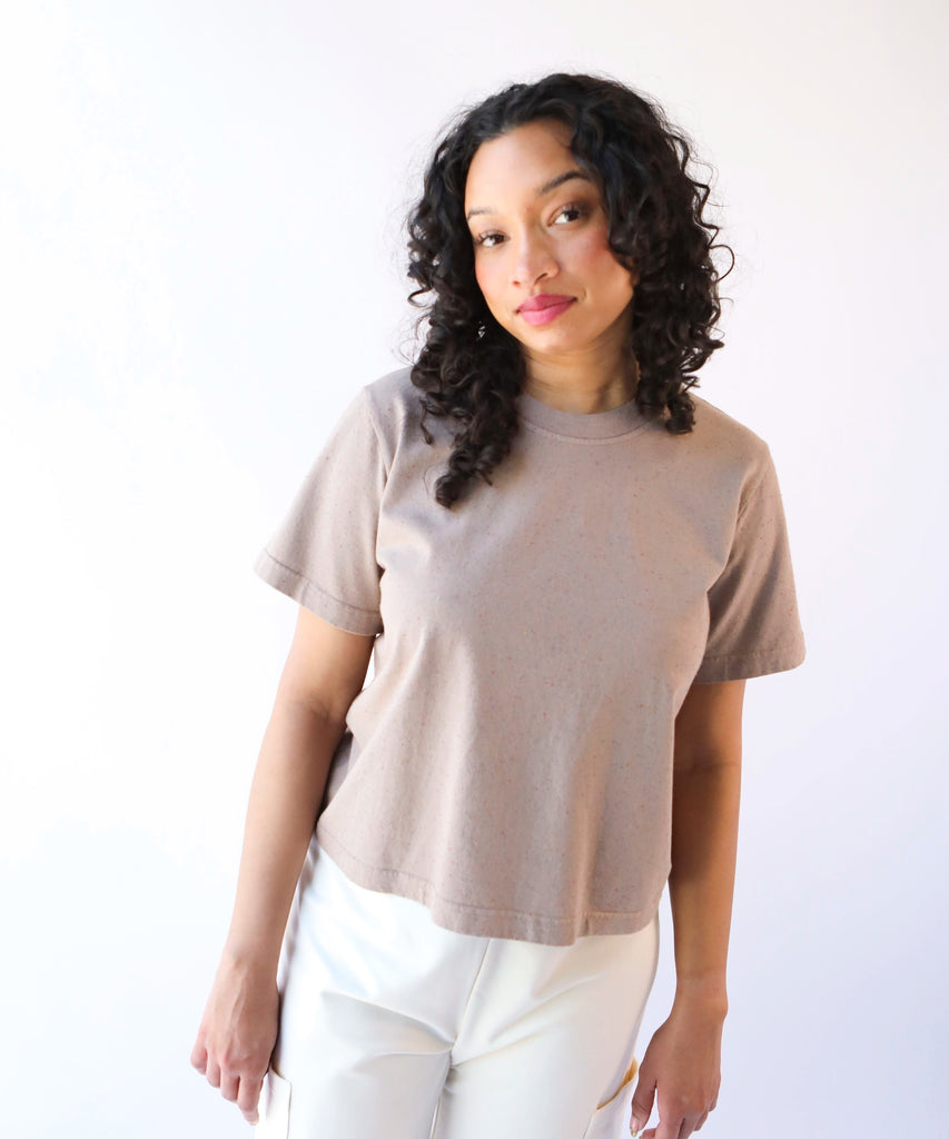 Woman wearing a beige taupe cotton t-shirt 
