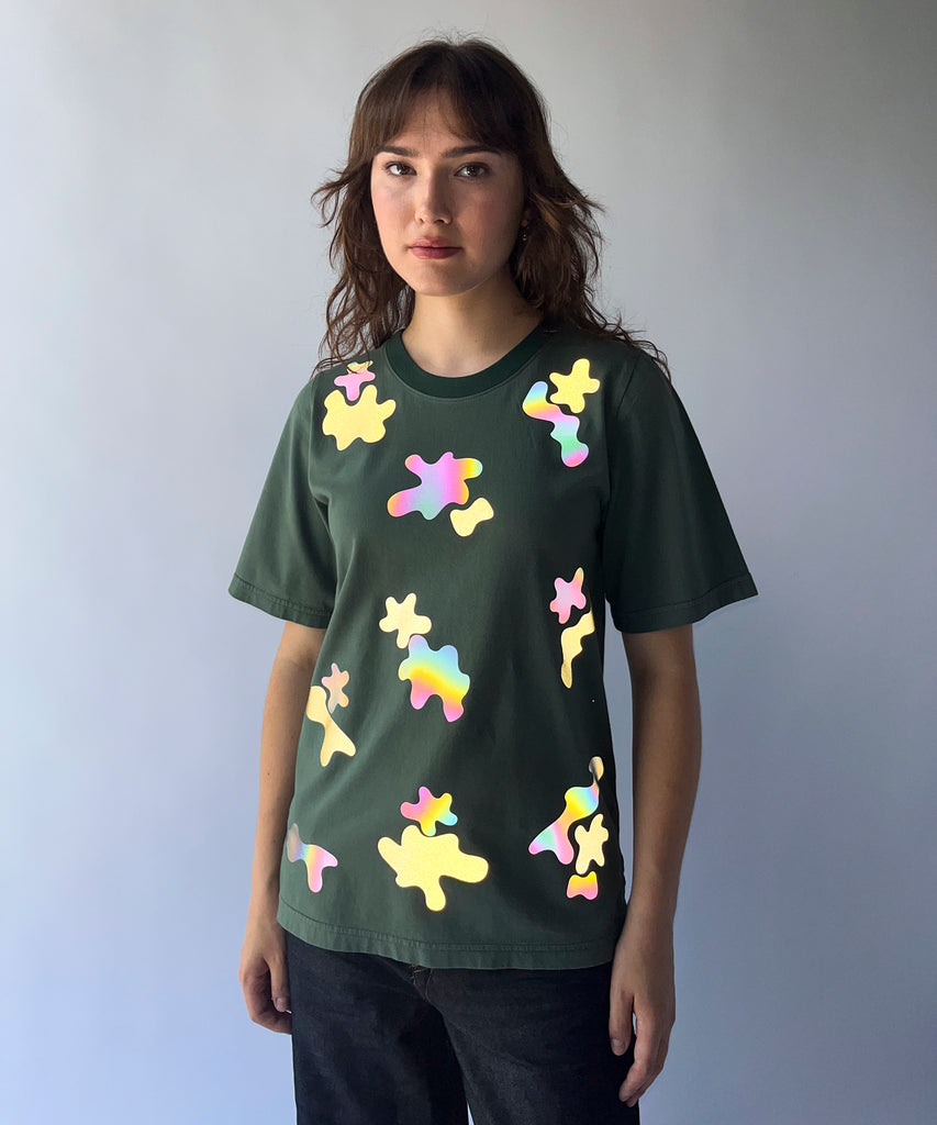 woman wearing a green reflective camouflage patterned cotton tshirt