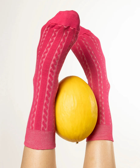 A pair of unisex, lightweight cable dressy cotton knee high socks in pink made in Canada by Toronto brand OkayOk 