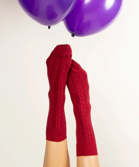 A pair of unisex, lightweight cable dressy cotton socks in dark grey with dark red made in Canada by Toronto brand OkayOk 