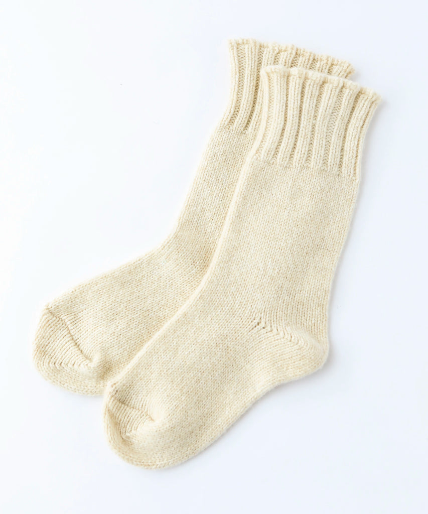 pair of wool knit socks in cream
