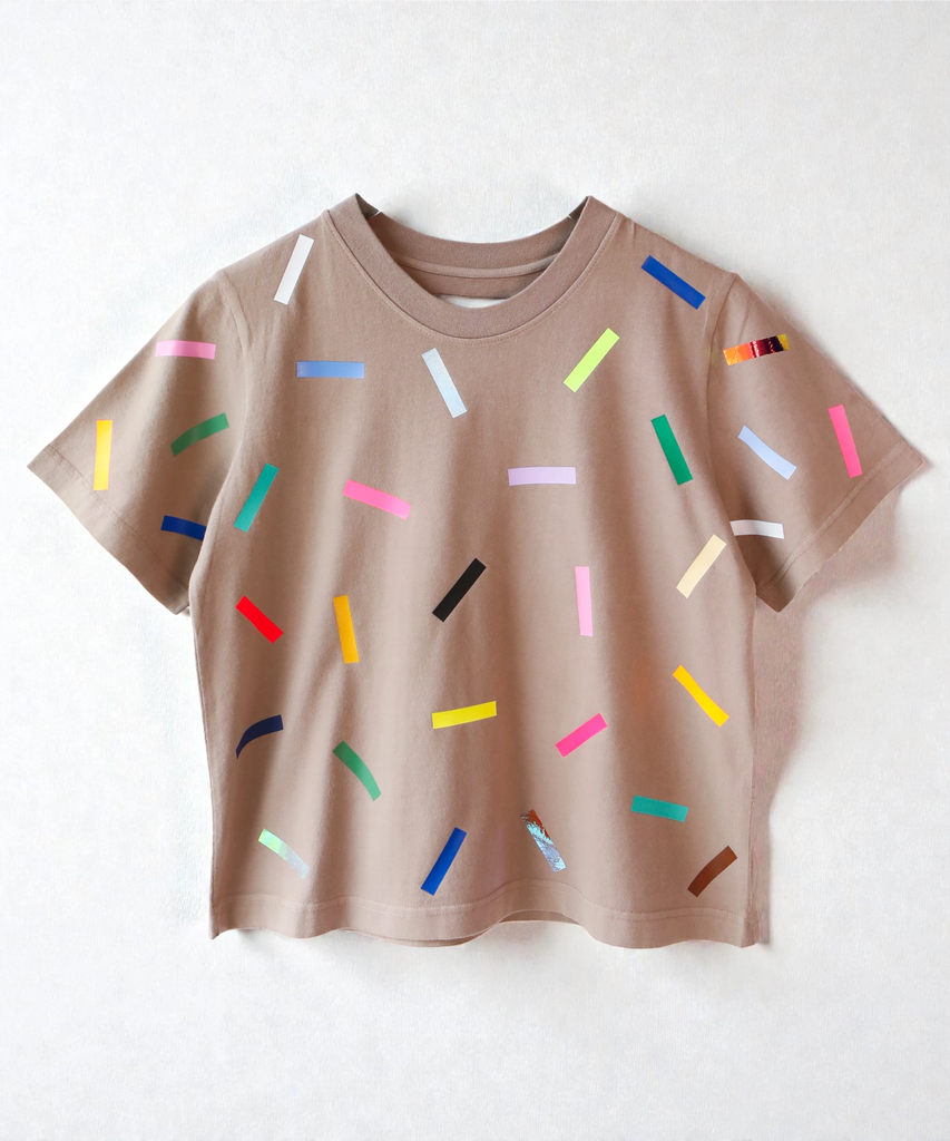 A 100% cotton tshirt with colourful sprinkles pattern in light beige brown 