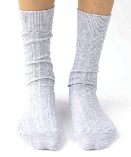 A pair of unisex, lightweight cable dressy cotton knee high socks in light grey made in Canada by Toronto brand OkayOk 